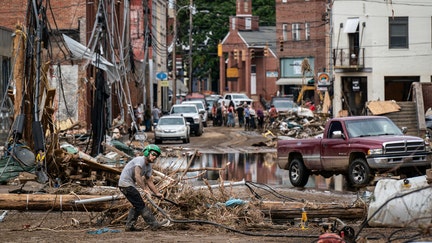 Marshall, NC - September 30 : Workers, community members, and business owners clean up debris in the aftermath of Hurricane Helene in Marshall, North Carolina on Monday, Sept. 30, 2024. (Photo by Jabin Botsford/The Washington Post via Getty Images)
