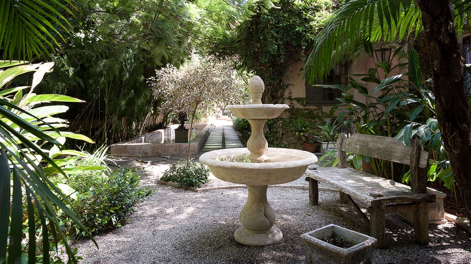 Behind the house there is also a fountain and a shallow pool.