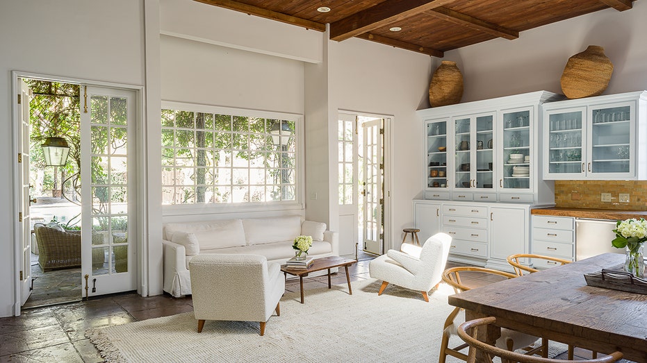 The family room leads to another living area off the kitchen.