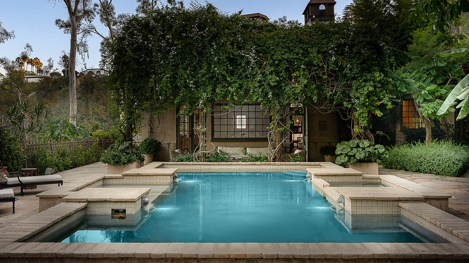 The heated pool also features a hot tub.