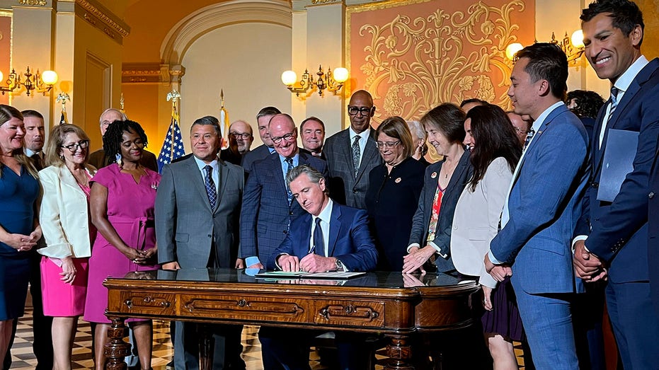 Gavin Newsom signs a bill 