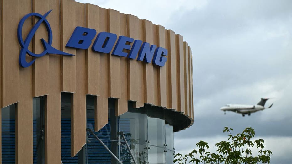 Airplanes fly on Boeing building