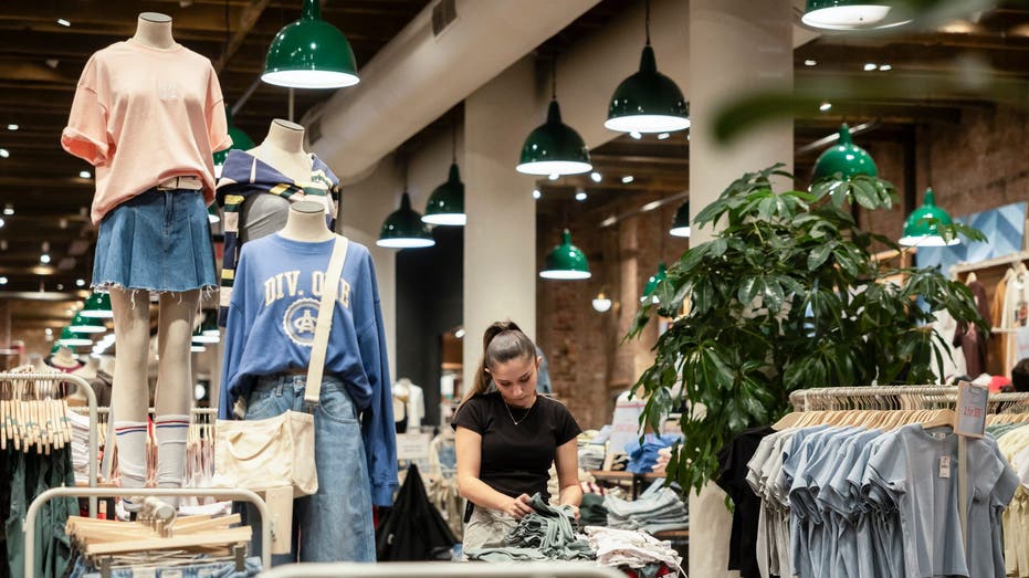 Retail worker organizing merchandise