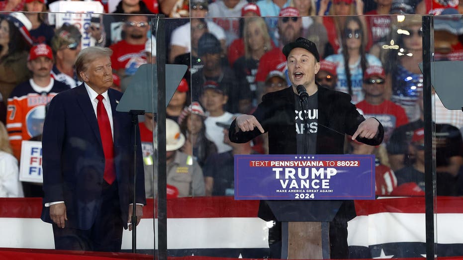 Musk speaks on stage next to Trump at Butler rally