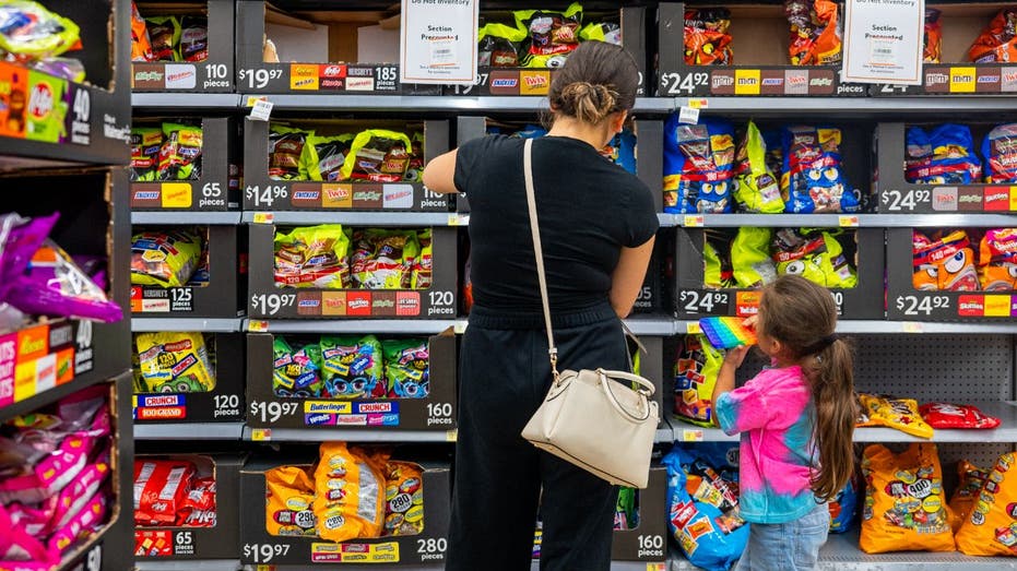 woman and child in the candy aisle