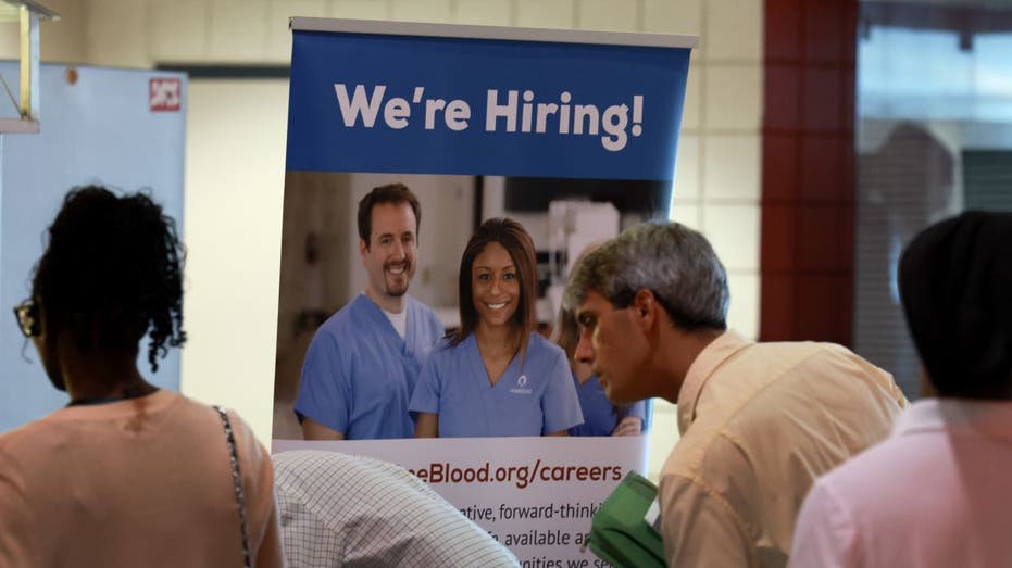 Hiring sign at a job fair