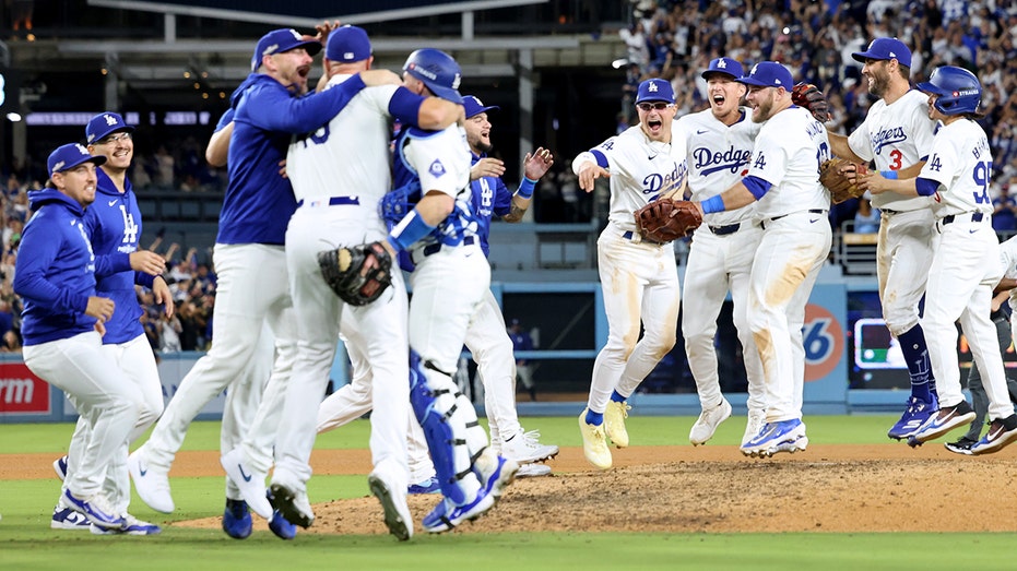 LOS ANGELES, CALIFORNIA - OCTOBER 20: The Los Angeles Dodgers celebrate the final out and a 10- 5 win over the New York Mets during Game 6 of the National League Championship Series at Dodger Stadium on October 20, 2024 in Los Angeles, California. (Photo by Harry How/Getty Images)