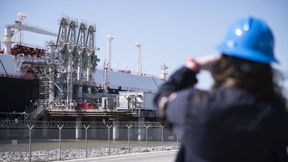 LNG facility with tanker and worker