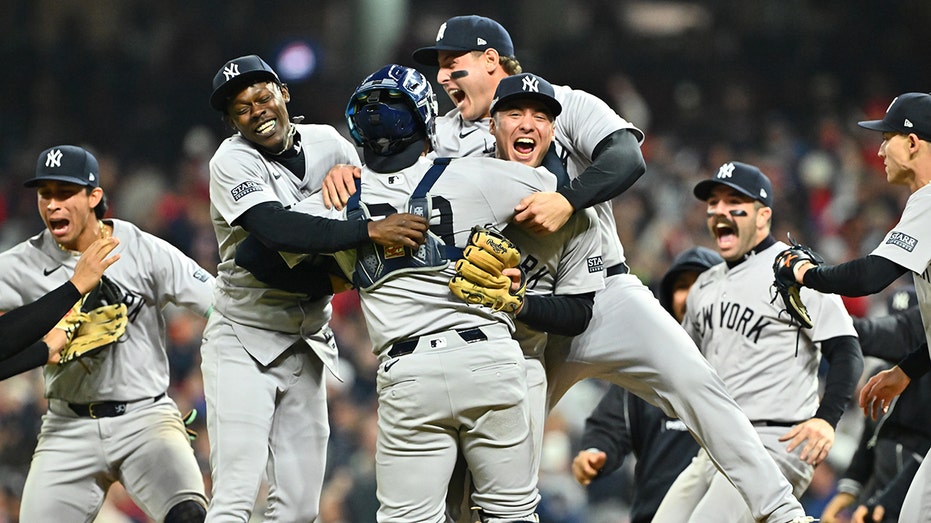 CLEVELAND, OHIO - OCTOBER 19: The New York Yankees celebrate after beating the Cleveland Guardians 5-2 in 10 innings to win Game Five of the American League Championship Series at Progressive Field on October 19, 2024 in Cleveland, Ohio. (Photo by Jason Miller/Getty Images)