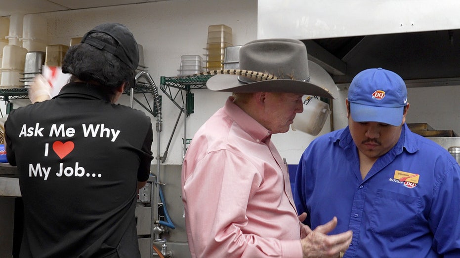 Robert Mayfield talks to staff in the kitchen