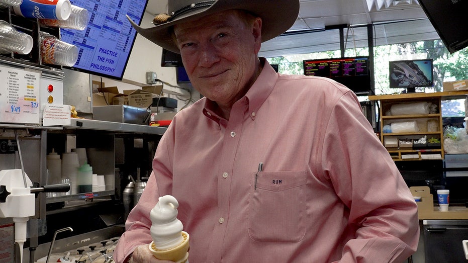 Robert Mayfield holds soft serve cone in Dairy Queen