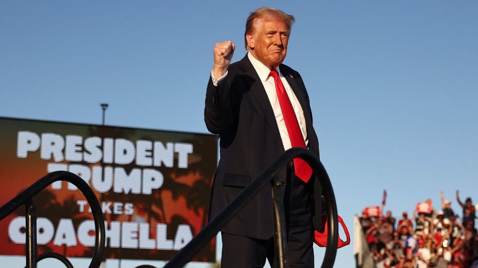 Trump pumps his fist during the rally