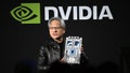 Jensen Huang, co-founder and chief executive officer of Nvidia Corp., holds up the companys AI accelerator chips for data centers. - Fox News