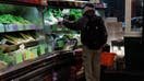 A shopper at the Reading Terminal Market in Philadelphia, Pennsylvania, US, on Monday, Feb. 12, 2024. The Bureau of Labor Statistics is scheduled to release US consumer price index (CPI) urban consumers figures on February 13. 