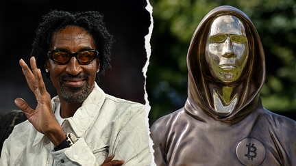 NBA legend Scottie Pippen pictured alongside a statue of Satoshi Nakamoto, a presumed pseudonym used by the inventor of Bitcoin. 