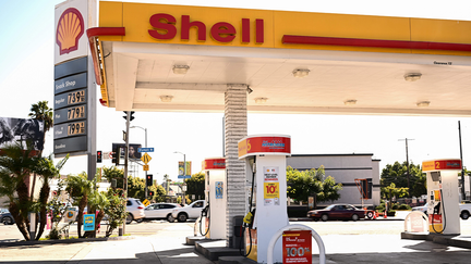 FILE: A sign shows gasoline fuel prices above average at over seven and approaching eight dollars a gallon at a Shell gas station in Los Angeles, California, on October 5, 2023.