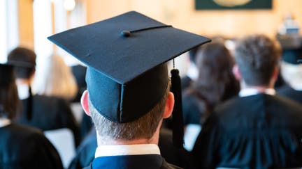 29 July 2022, Baden-Wuerttemberg, Mannheim: A man wears a graduation hat at a graduation ceremony of his university. Photo: Silas Stein/dpa (Photo by Silas Stein/picture alliance via Getty Images)