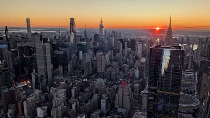The sun rises behind the Empire State Building as seen from the EdgeNYC observation deck at Hudson Yards on November 8, 2024, in New York City.   - Fox Business News