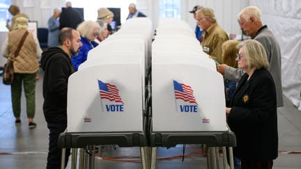 Voters make selections at their voting booths inside an early voting site on October 17, 2024 in Hendersonville, North Carolina. Several counties effected by Hurricane Helene saw a large turnout of residents for the first day of early voting in Western North Carolina.