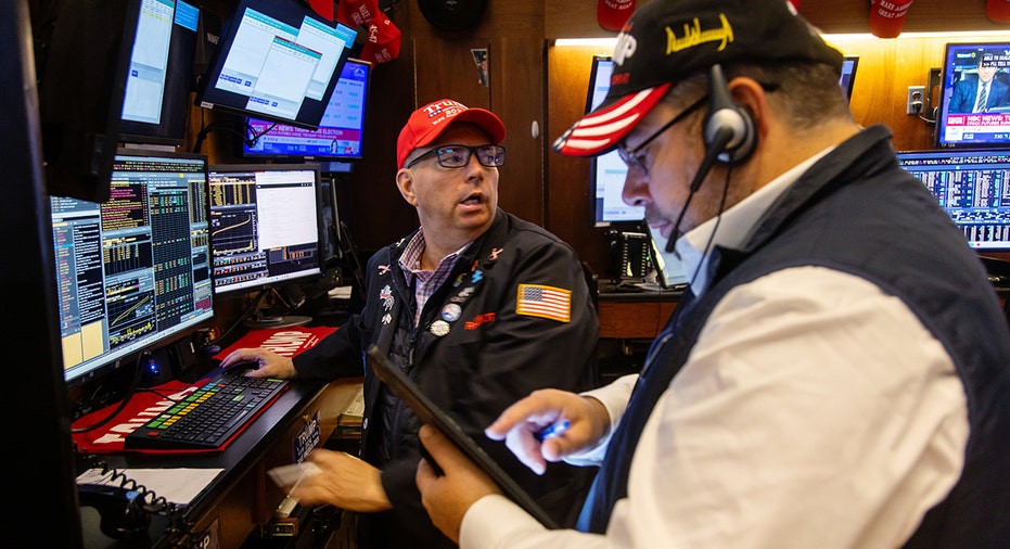 Market traders wear Trump hats