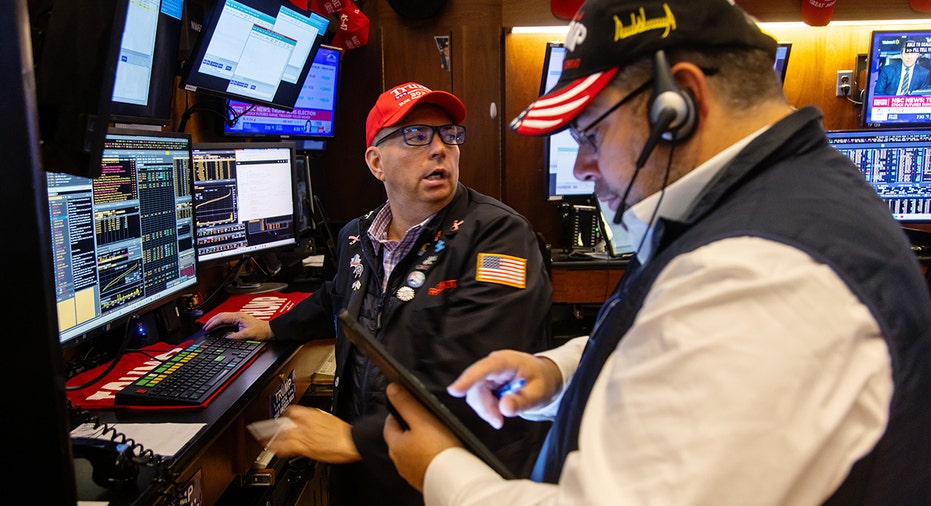 Market traders wear Trump hats