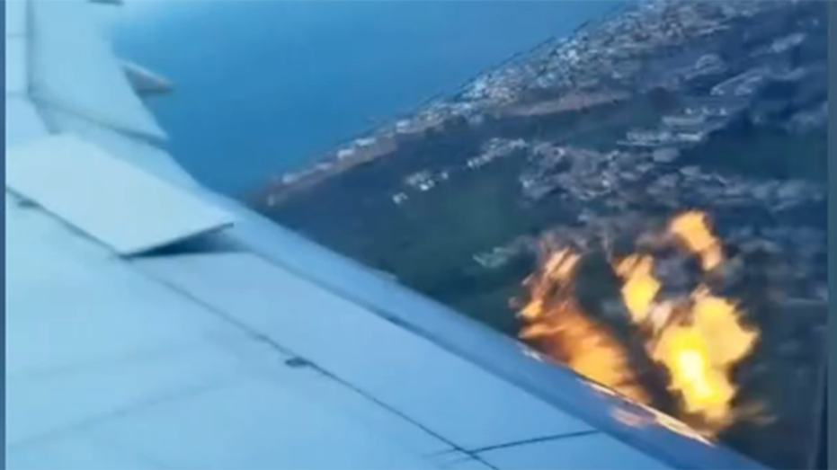 Flames trail from Boeing plane after takeoff from Italy