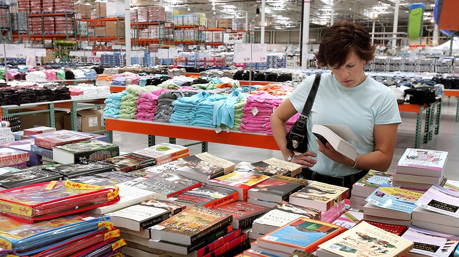 Shopper looking at books at Costco