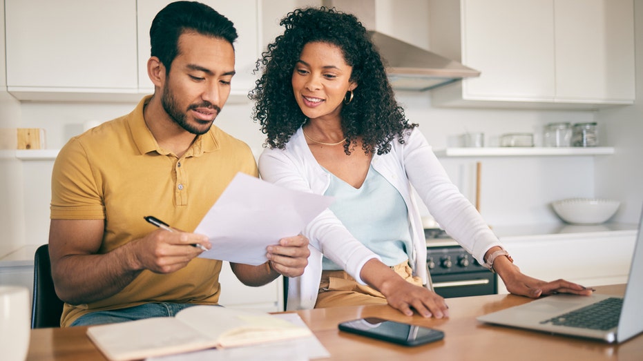 The couple organizes their finances 