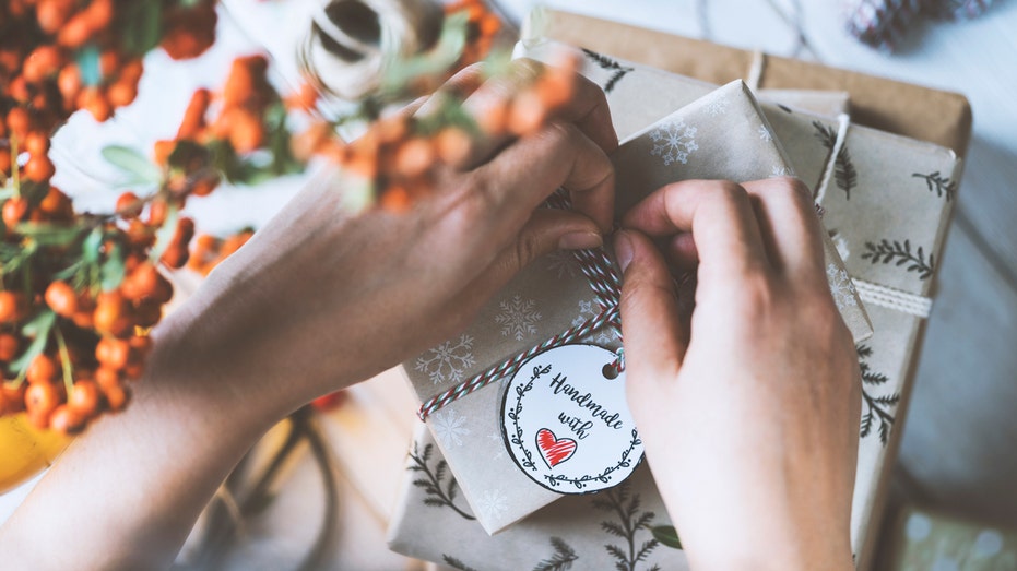 Person wrapping a handmade Christmas gift