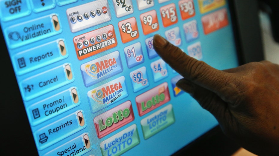 CHICAGO, IL - DECEMBER 17: A clerk prints a Mega Millions lottery ticket at a convenience store on December 17, 2013 in Chicago, Illinois. The jackpot is currently the second largest in U.S. history. (Photo by Scott Olson/Getty Images)