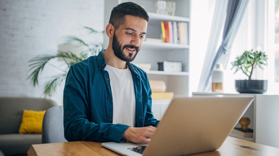 A man on computer at home