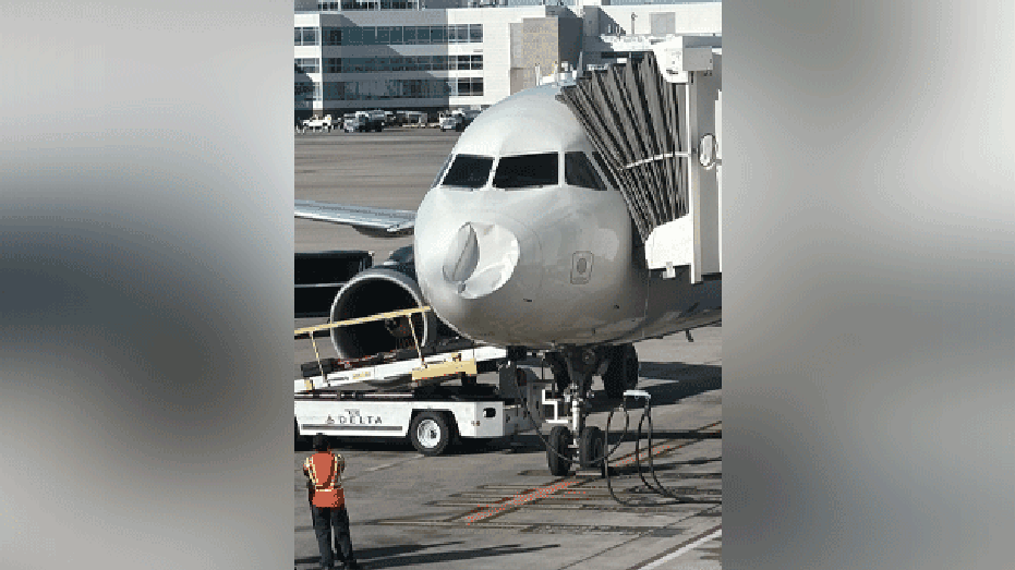 DL1648 in Denver with nose damage