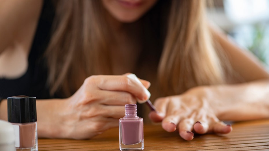 Close-up of a woman painting her nails