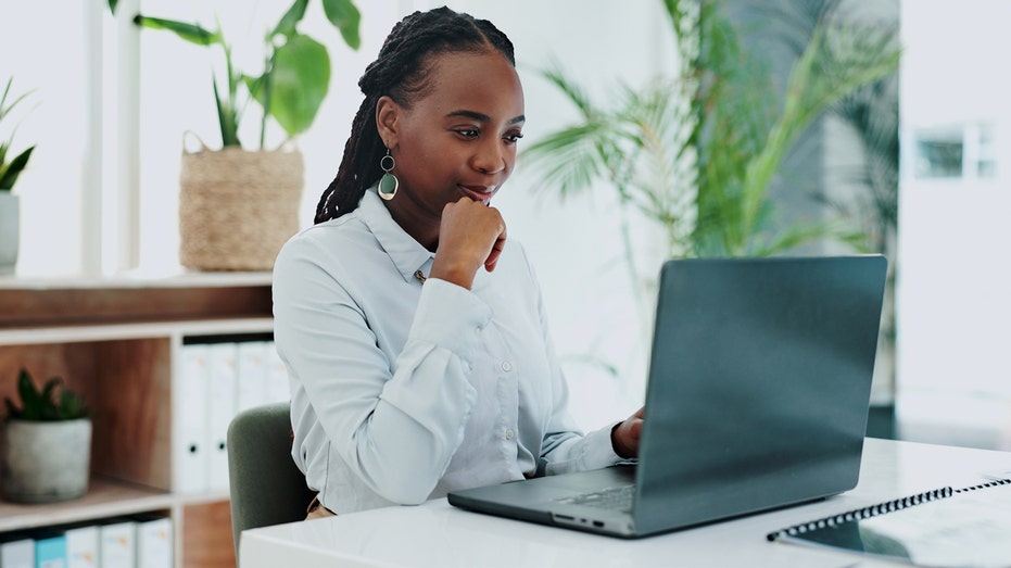 A woman working on her computer