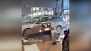 A still taken from video of the incident at the car dealership (Credit: Jam Press)