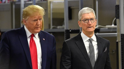 US President Donald Trump (L) and Apple CEO Tim Cook tour the Flextronics computer manufacturing facility where Apple's Mac Pros are assembled in Austin, Texas, on November 20, 2019. (Photo by MANDEL NGAN / AFP) (Photo by MANDEL NGAN/AFP via Getty Images)