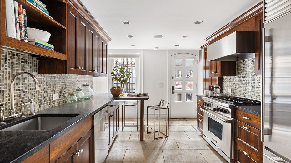 The eat-in kitchen has high-quality appliances and a breakfast bar.