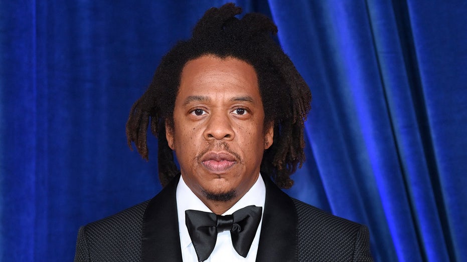 Jay-Z wears black suit at premiere in London