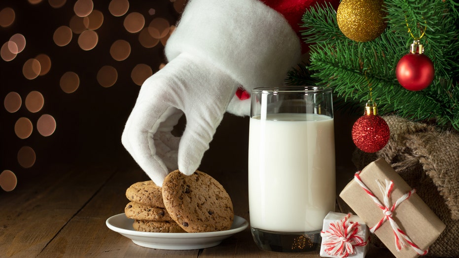 Santa reaching for cookies left out for him