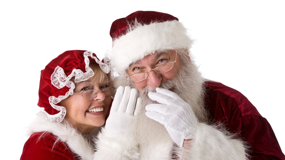 Mrs. Claus and Santa Claus laughing