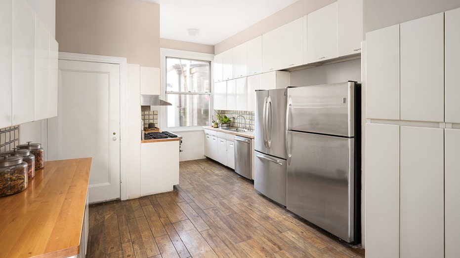 The large kitchen is located behind the dining room.