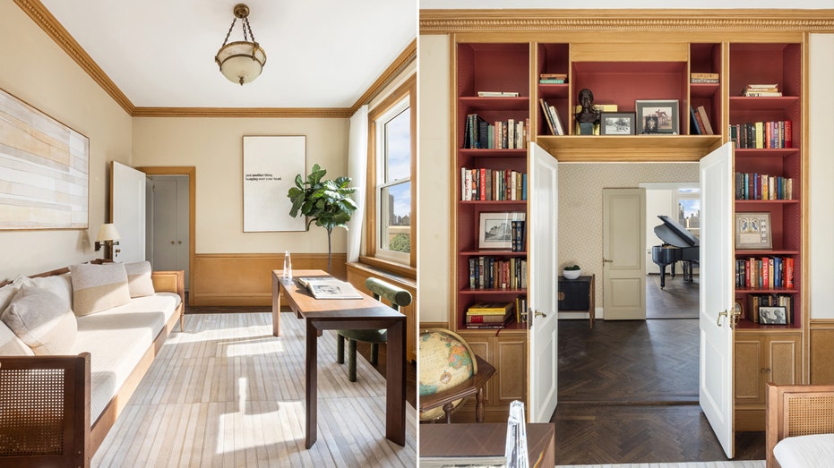 The spare room has built-in bookshelves and a bay window. 