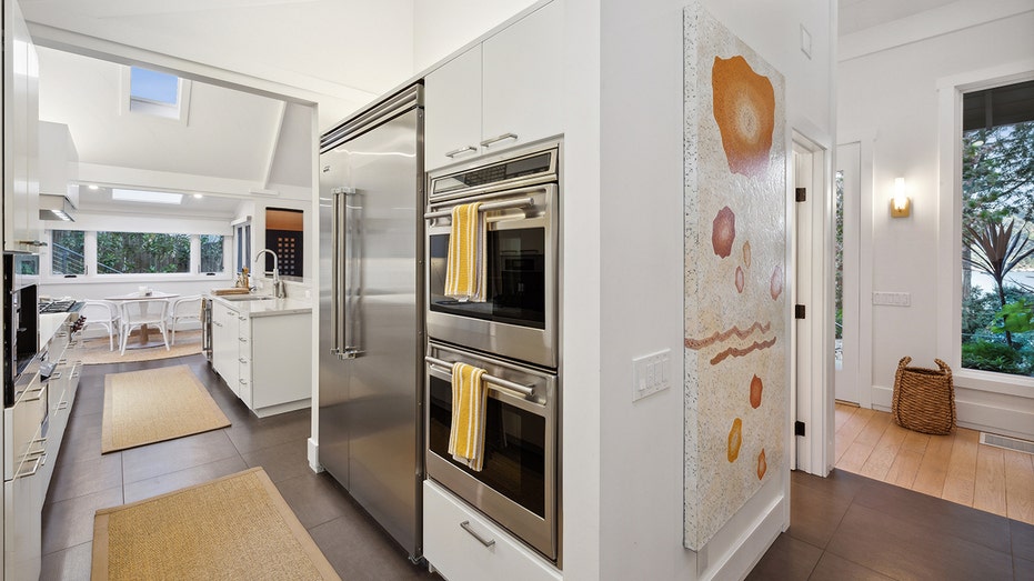 View of Robert Redford's Tiburon kitchen with a large fridge and double ovens