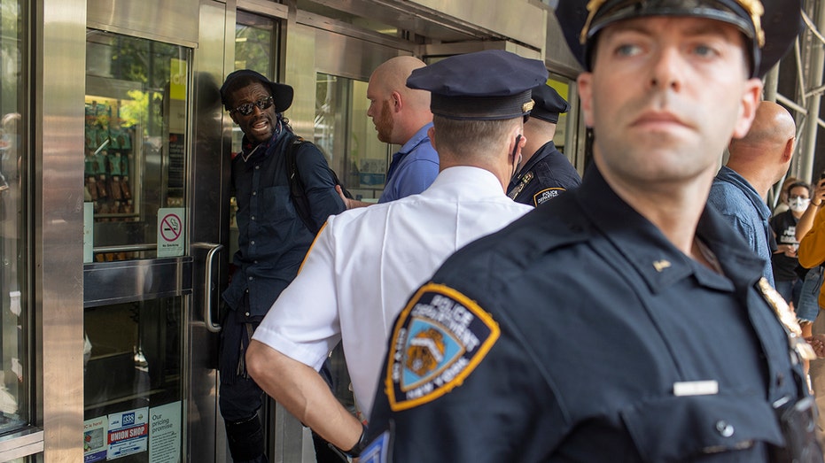 New York City police officers arresting a man