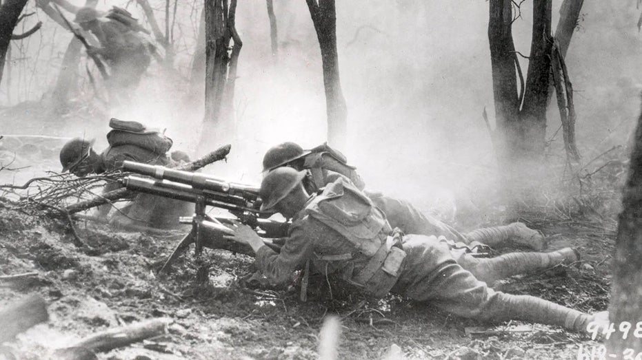 US soldiers of the 23rd Infantry, 2nd Division, firing a 37mm machine gun at a German position in the Argonne Forest, during the Meuse-Argonne offensive, 26th September - 11th November 1918.