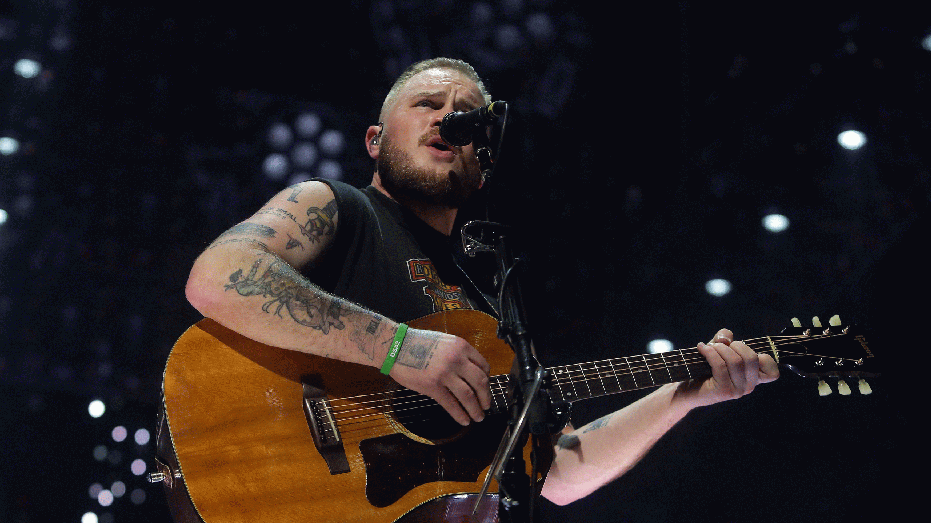 GLENDALE, ARIZONA - DECEMBER 03: Zach Bryan performs at Desert Diamond Arena on December 03, 2024 in Glendale, Arizona. (Photo by John Medina/Getty Images)