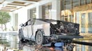 A Tesla Cybertruck exploded in flames outside the Trump International Hotel Las Vegas on Wednesday, killing the driver and injuring seven others. The Las Vegas Metropolitan Police Department released footage showed the moment of the explosion with charred gasoline canisters and firework mortars in the bed of the badly burned truck. Authorities believe fireworks, gas tanks, and camping fuel were connected to a detonation system controlled by the driver in the Tesla Cybertruck that exploded outside the Hotel in Las Vegas Wednesday morning. 
