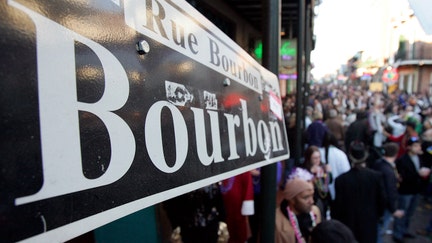 NEW ORLEANS - FEBRUARY 16: Revelers walk along Bourbon Street in the French Quarter during Mardi Gras day on February 16, 2010 in New Orleans, Louisiana. The annual Mardi Gras celebration ends at midnight, when the Catholic Lenten season begins on Ash Wednesday and ends on Easter Sunday. (Photo by Patrick Semansky/Getty Images)