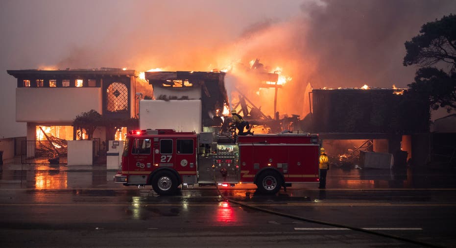 MALIBU, CA - January 08: Firefighters continue to battle wind and fire as homes go up in flames in Malibu along Pacific Coast Highway near Carbon Canyon Road in the Palisades Fire on Wednesday, January 8, 2025 (Photo by David Crane/MediaNews Group/Los Angeles Daily News via Getty Images)