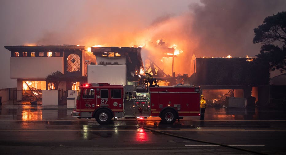 MALIBU, CA - January 08: Firefighters continue to battle wind and fire as homes go up in flames in Malibu along Pacific Coast Highway near Carbon Canyon Road in the Palisades Fire on Wednesday, January 8, 2025 (Photo by David Crane/MediaNews Group/Los Angeles Daily News via Getty Images)